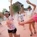 A runner is sprayed with pink powder in the Ypsilanti Color Run 5K on Sunday morning. Melanie Maxwell I AnnArbor.com